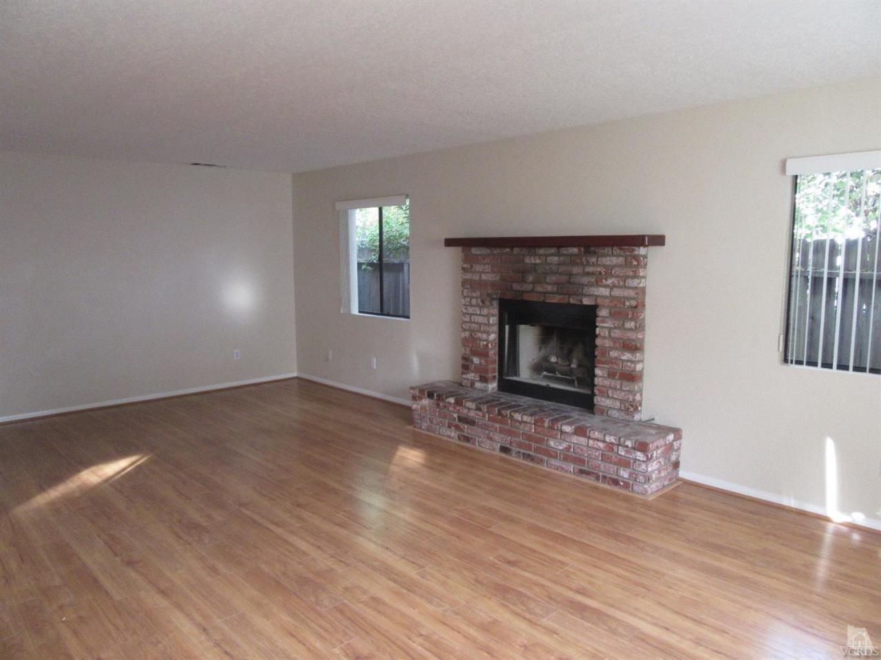 509 Drown Avenue Ojai, CA 93023 - Photo 2 of 17 a view of empty room with wooden floor and fireplace