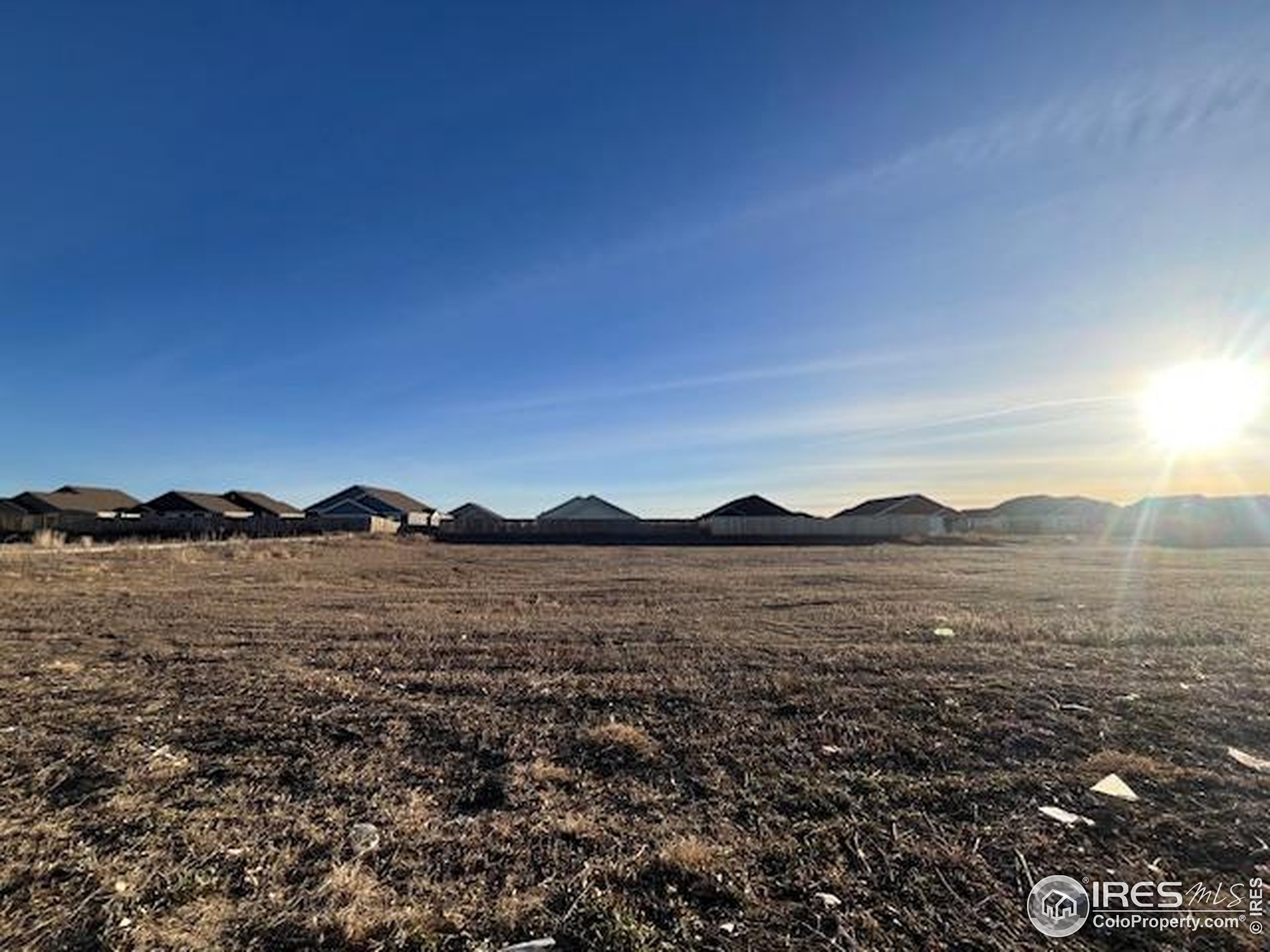 0 6th Avenue, Unit LOT 3 Wiggins, CO 80654 - Photo 4 of 5 a view of an ocean and mountain
