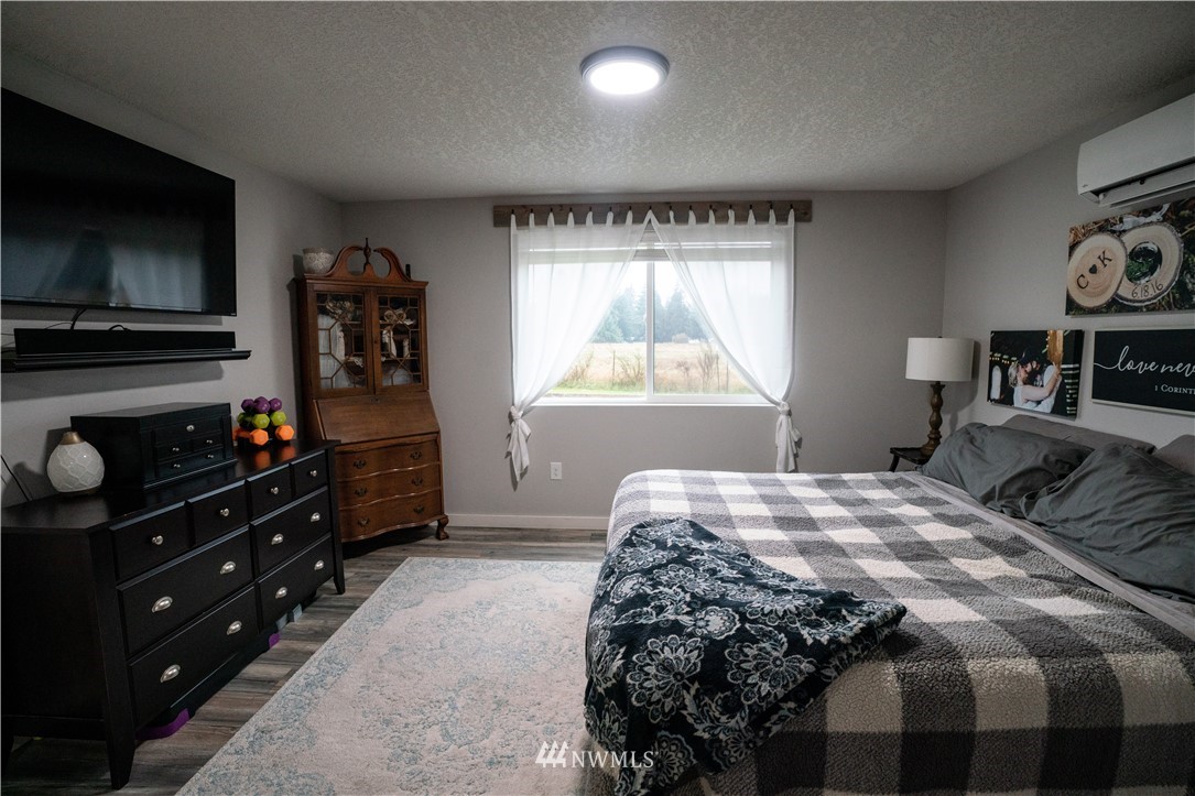 17729 Pendleton Street Southwest Rochester, WA 98579 - Photo 22 of 37 a bedroom with a bed and a television