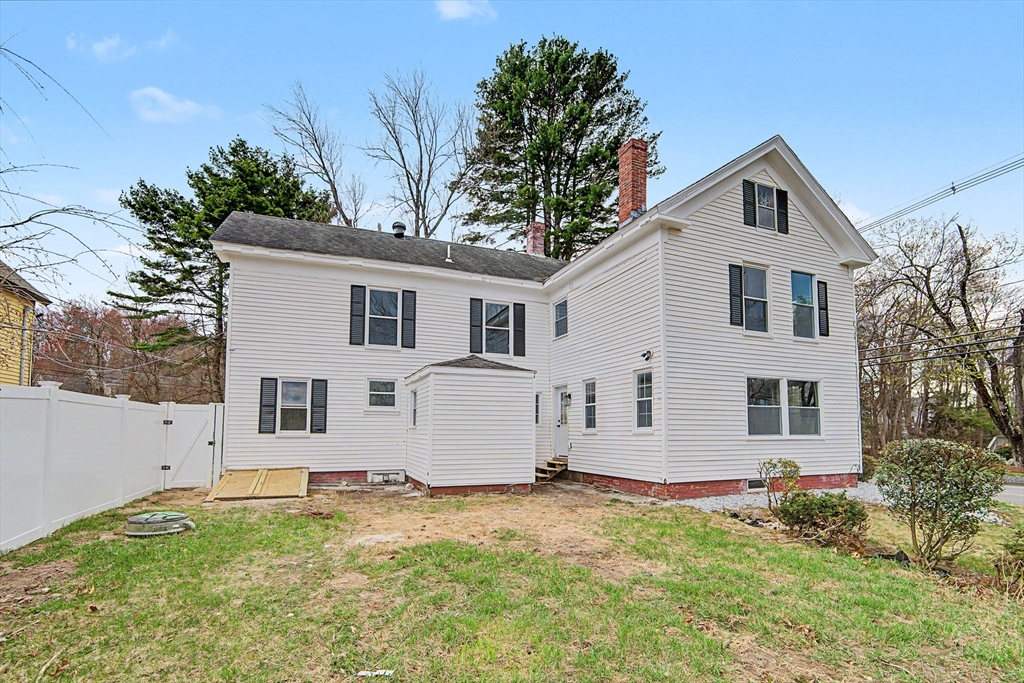 122 Chapin Road Hudson, MA 01749 - Photo 19 of 20 a view of a white house with a yard
