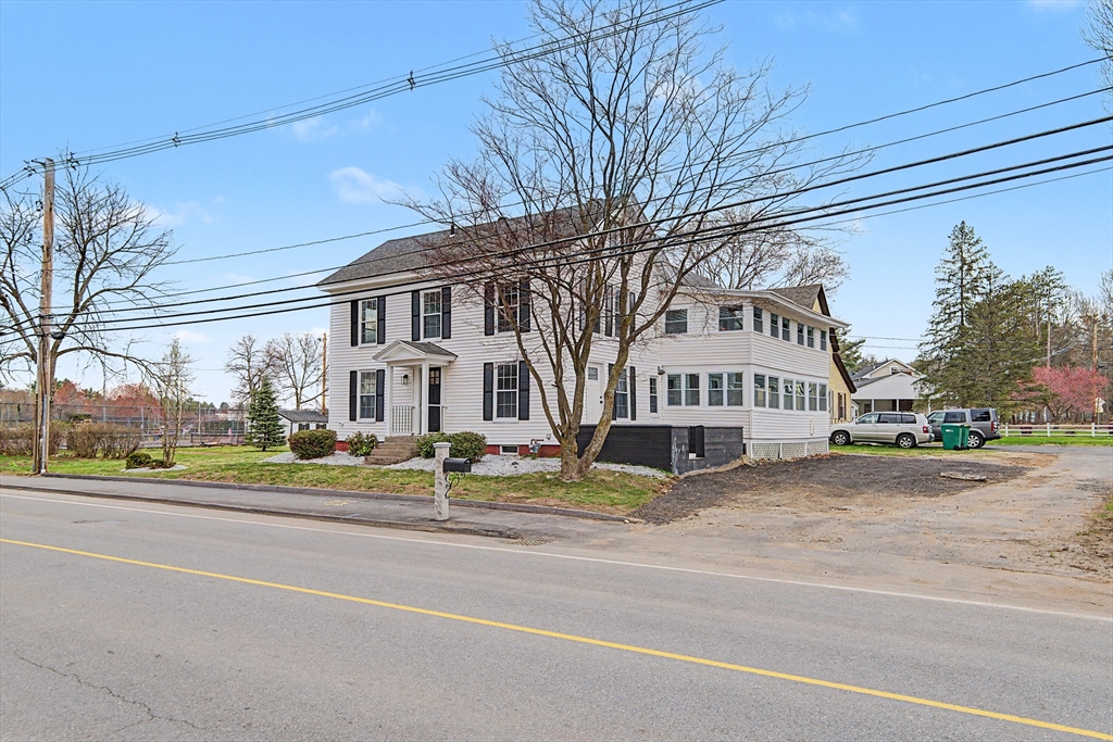 122 Chapin Road Hudson, MA 01749 - Photo 20 of 20 a view of white house with a big yard and large trees