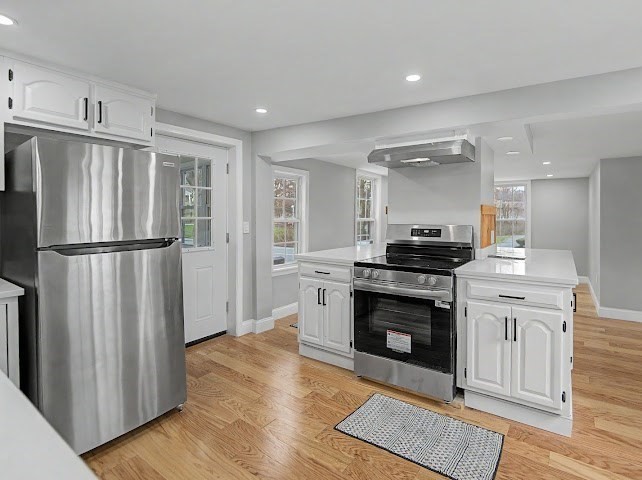 122 Chapin Road Hudson, MA 01749 - Photo 2 of 20 a kitchen with stainless steel appliances granite countertop a refrigerator stove top oven and sink