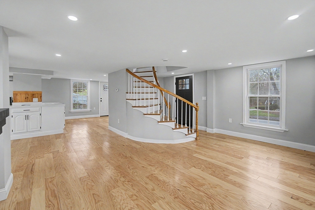 122 Chapin Road Hudson, MA 01749 - Photo 5 of 20 a view of an empty room with a window and wooden floor