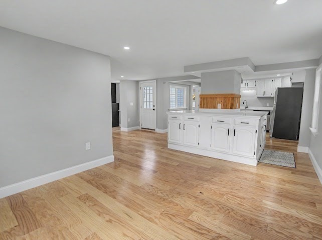 122 Chapin Road Hudson, MA 01749 - Photo 6 of 20 a view of a kitchen with wooden floor