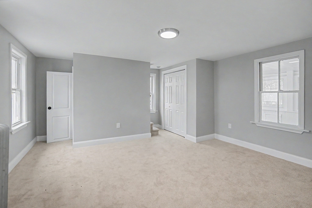 122 Chapin Road Hudson, MA 01749 - Photo 9 of 20 a view of an empty room with a window