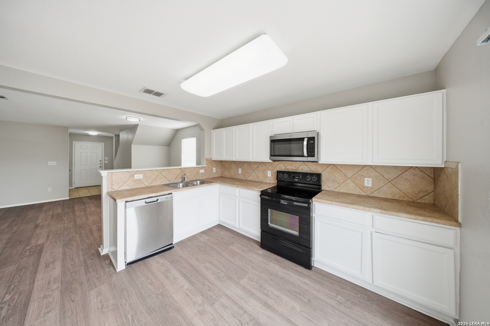 403 Walnut Crest Schertz, TX 78154 - Photo 12 of 30 a kitchen with a sink and a stove top oven