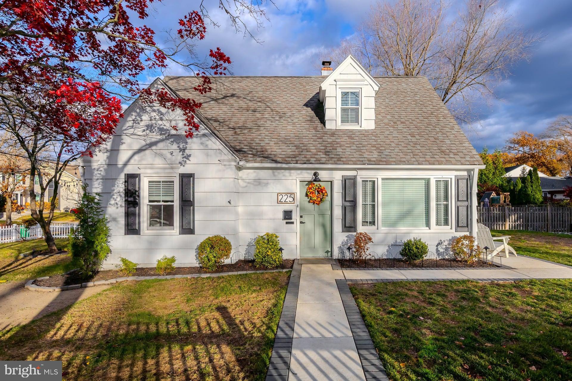 225 Spruce Street Haddonfield, NJ 08033 - Photo 1 of 28 a front view of a house with swimming pool and sitting area