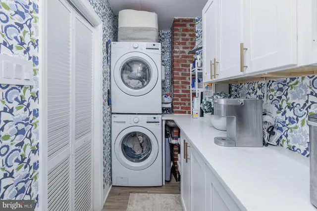 a utility room with dryer and washer