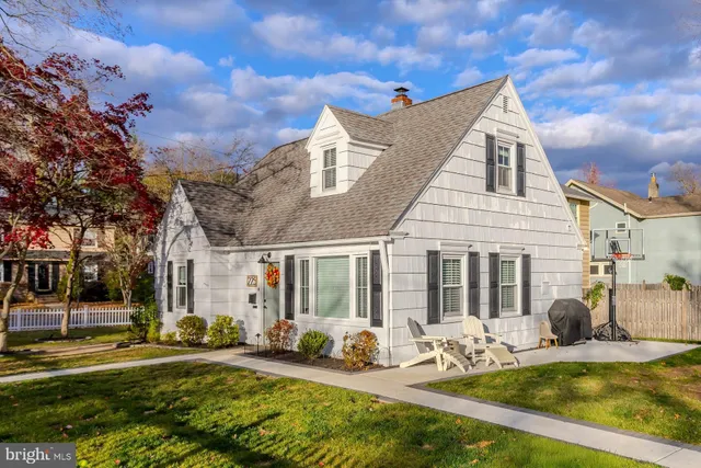 a view of a house with swimming pool and sitting area