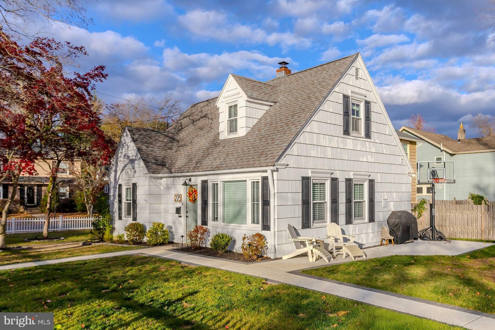 225 Spruce Street Haddonfield, NJ 08033 - Photo 2 of 28 a view of a house with swimming pool and sitting area