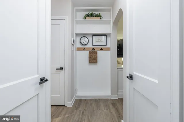a view of front door with wooden floor