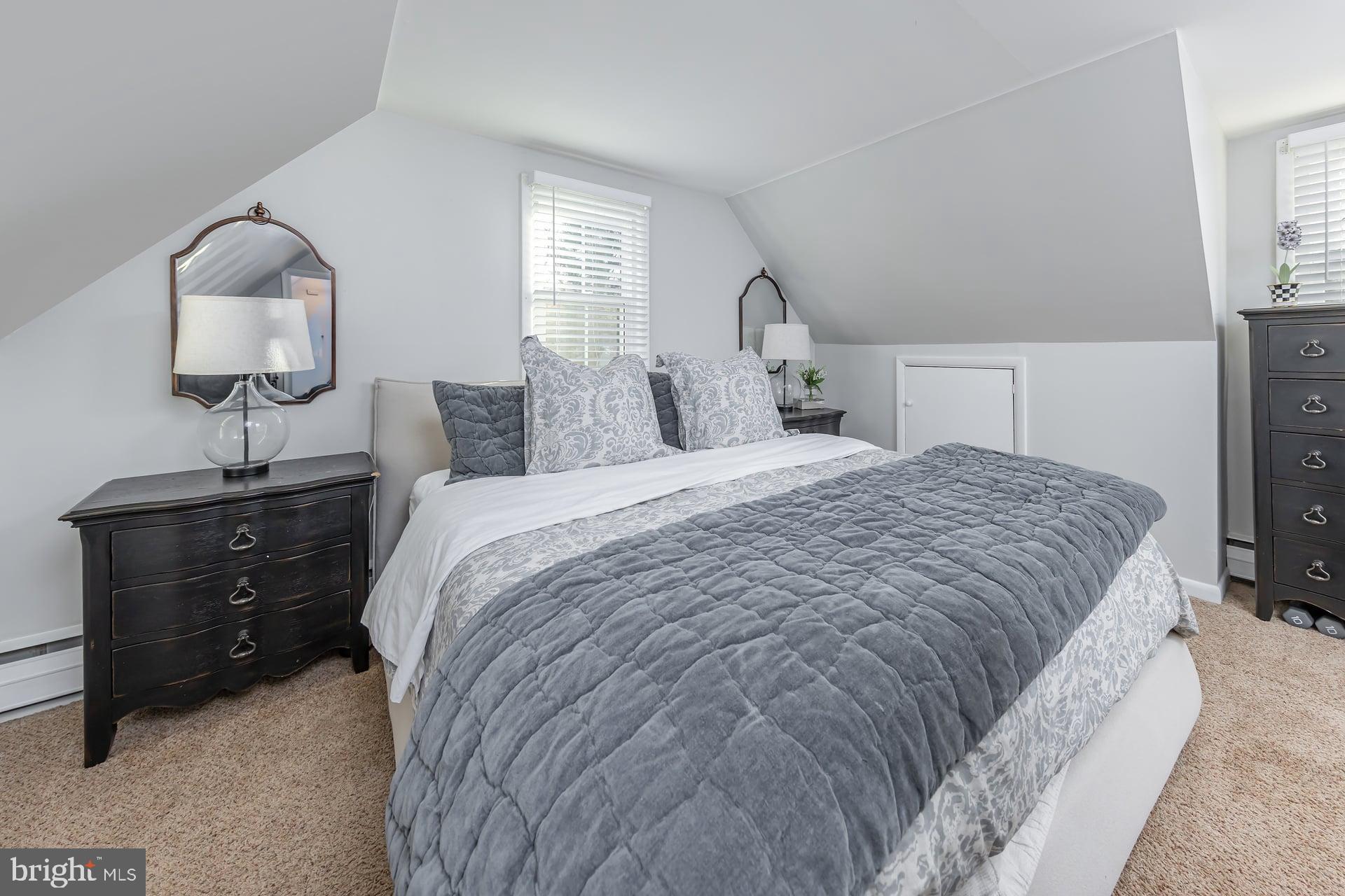 225 Spruce Street Haddonfield, NJ 08033 - Photo 25 of 28 a bedroom with a bed and window with lamp