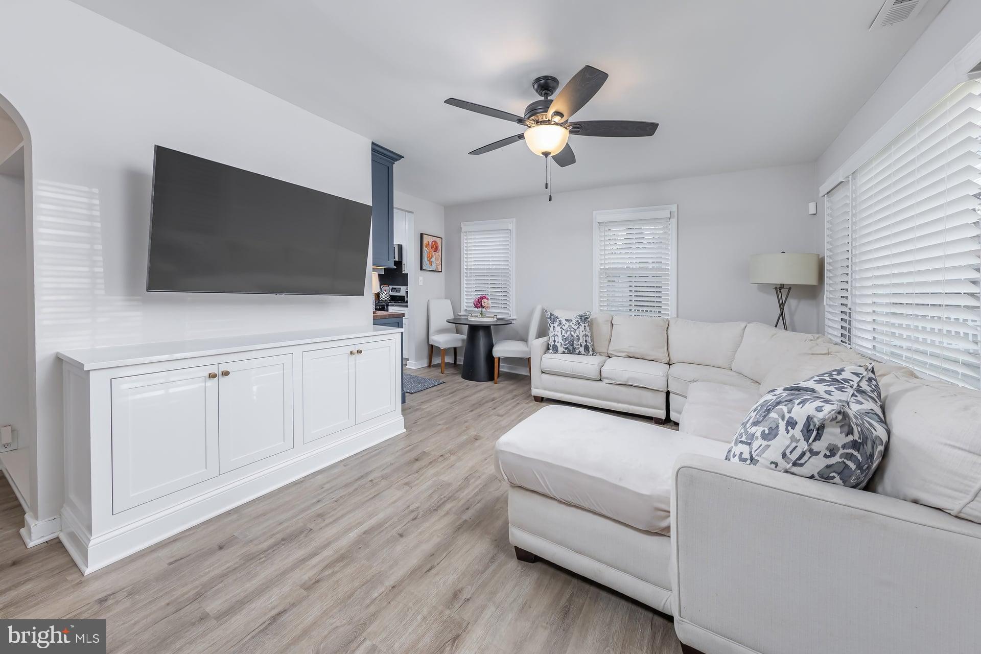 225 Spruce Street Haddonfield, NJ 08033 - Photo 10 of 28 a living room with furniture and a flat screen tv