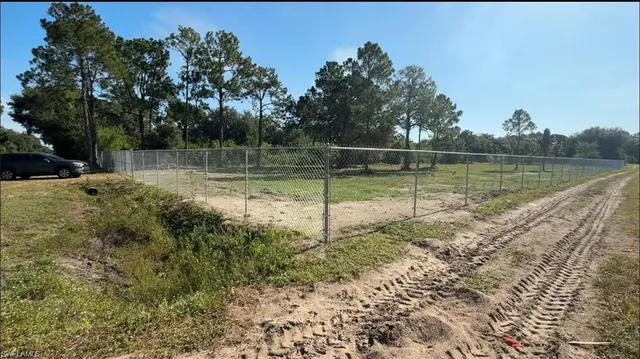 a view of a lake with a yard