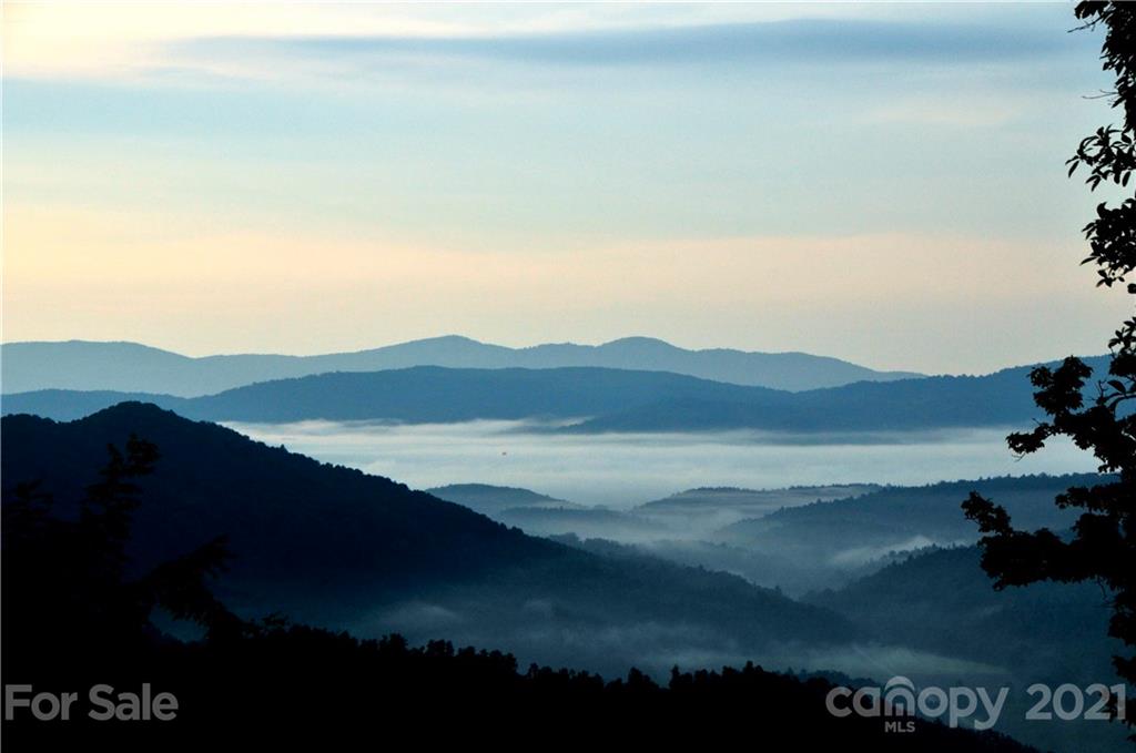 300 Arrowhead Road Ferguson, NC 28624 - Photo 1 of 48 a view of lake and mountain