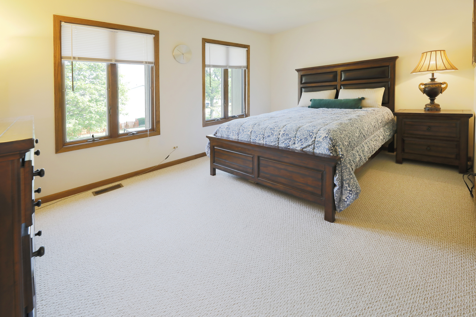1975 Brookside Lane Hoffman Estates, IL 60169 - Photo 22 of 32 a bed sitting in a bedroom next to a window