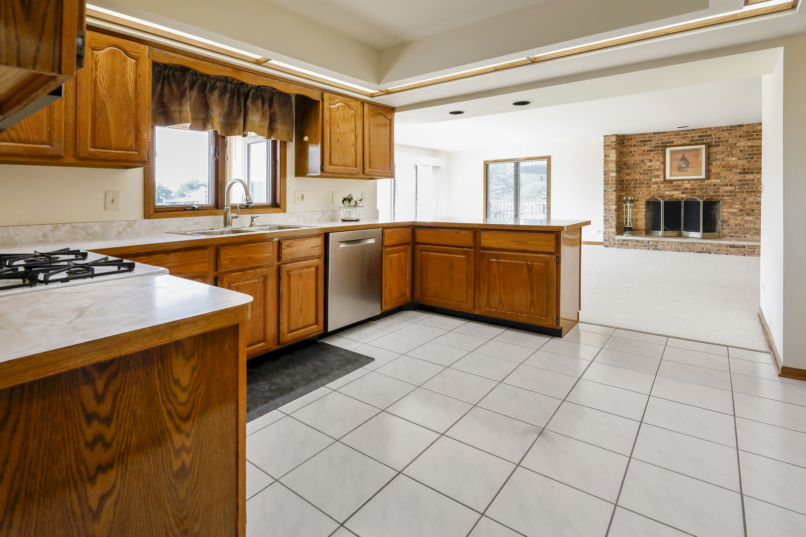 1975 Brookside Lane Hoffman Estates, IL 60169 - Photo 8 of 32 a kitchen with stainless steel appliances a sink cabinets and window