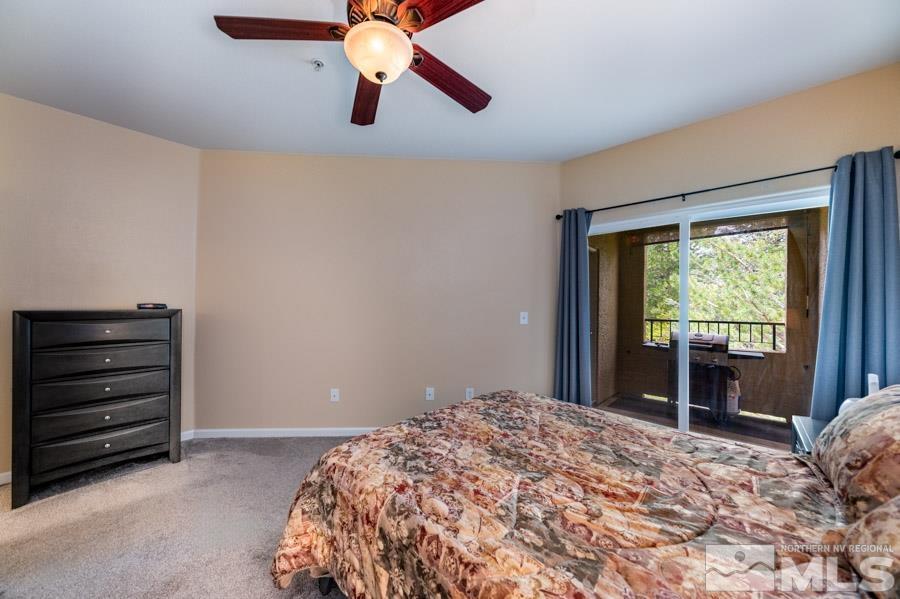 9050 Double R Boulevard Reno, NV 89521 - Photo 28 of 40 a bedroom with a bed and a window