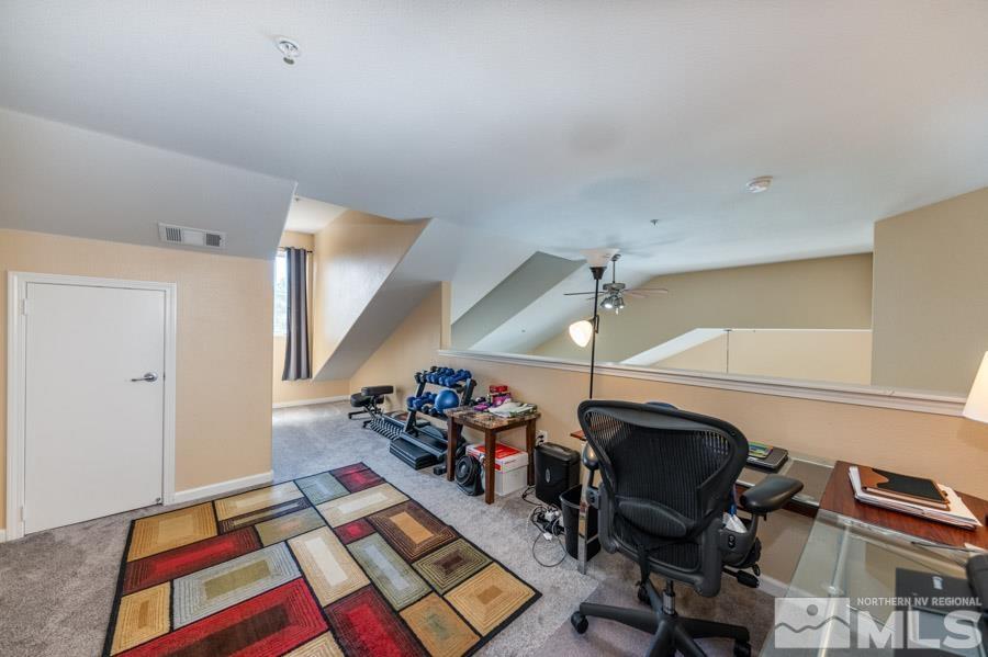 9050 Double R Boulevard Reno, NV 89521 - Photo 33 of 40 a room with furniture and a rug