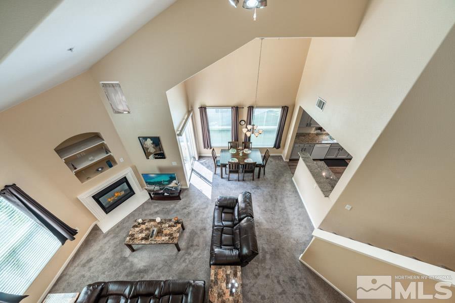 9050 Double R Boulevard Reno, NV 89521 - Photo 34 of 40 a living room with furniture and a floor to ceiling window