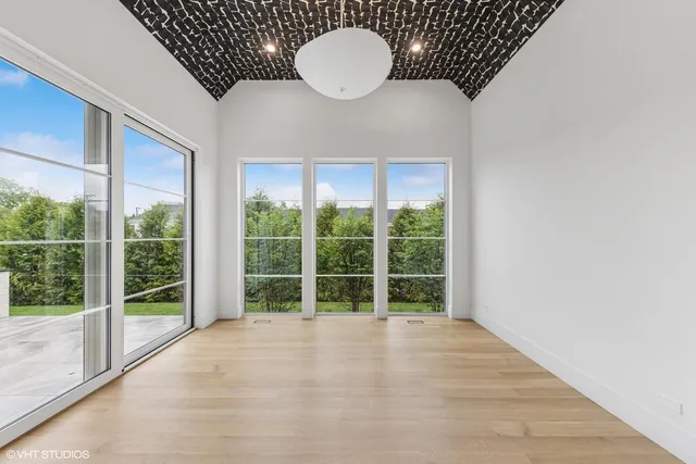 a view of an empty room with glass door