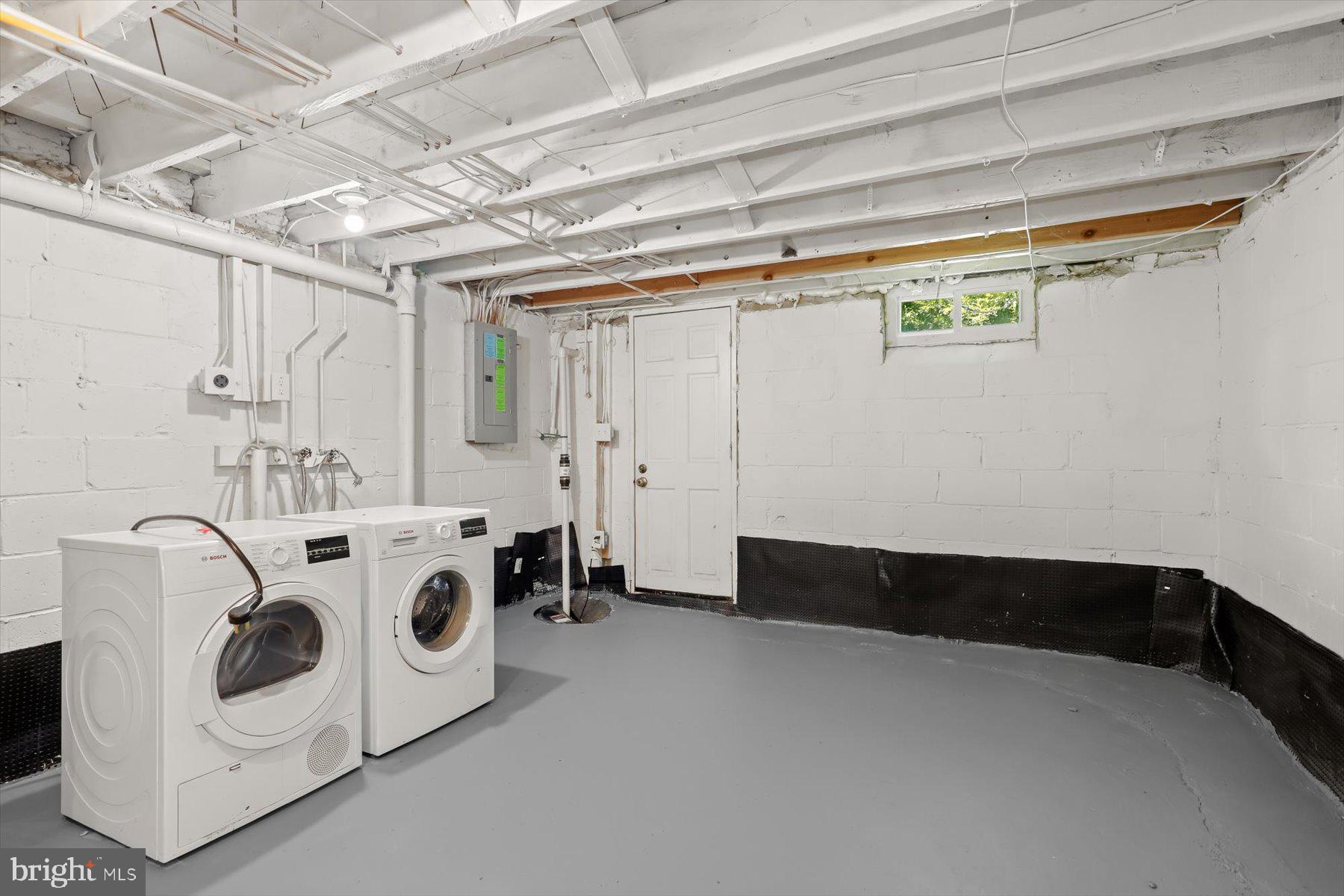 1044 Ellicott Driveway Baltimore, MD 21216 - Photo 17 of 26 a utility room with dryer and washer