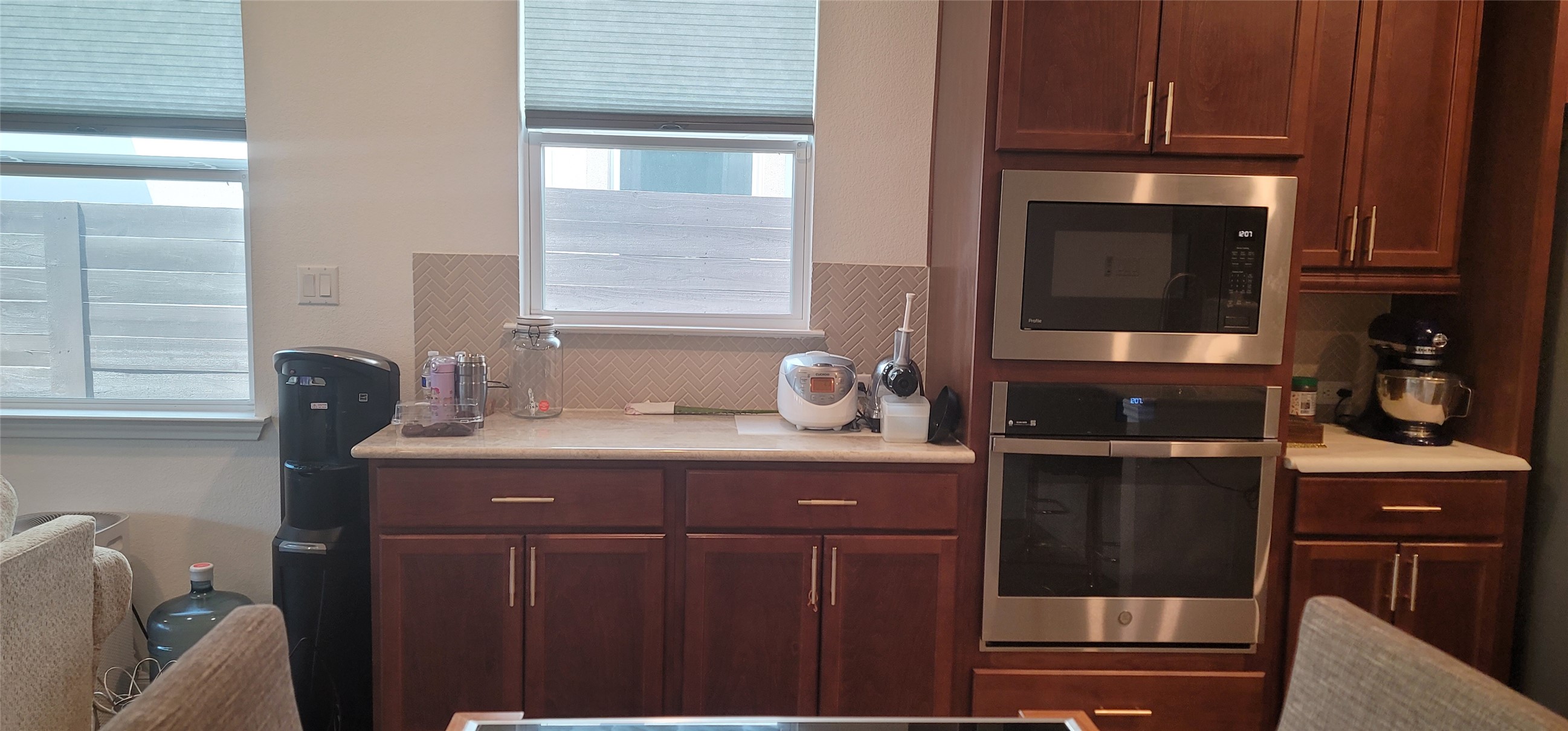 716 Leeward Pass Leander, TX 78641 - Photo 11 of 26 Functional kitchen with ample cabinet space and modern stainless steel appliances.