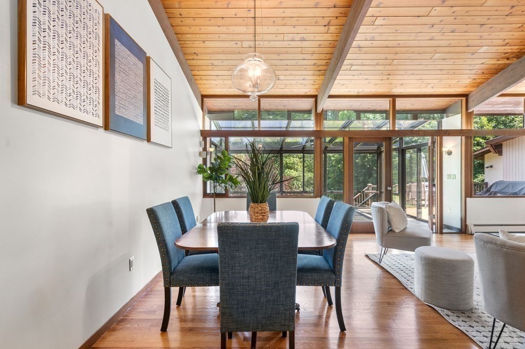 20 Meadowbrook Road Westwood, MA 02090 - Photo 11 of 36 a view of a dining room with furniture large windows and wooden floor