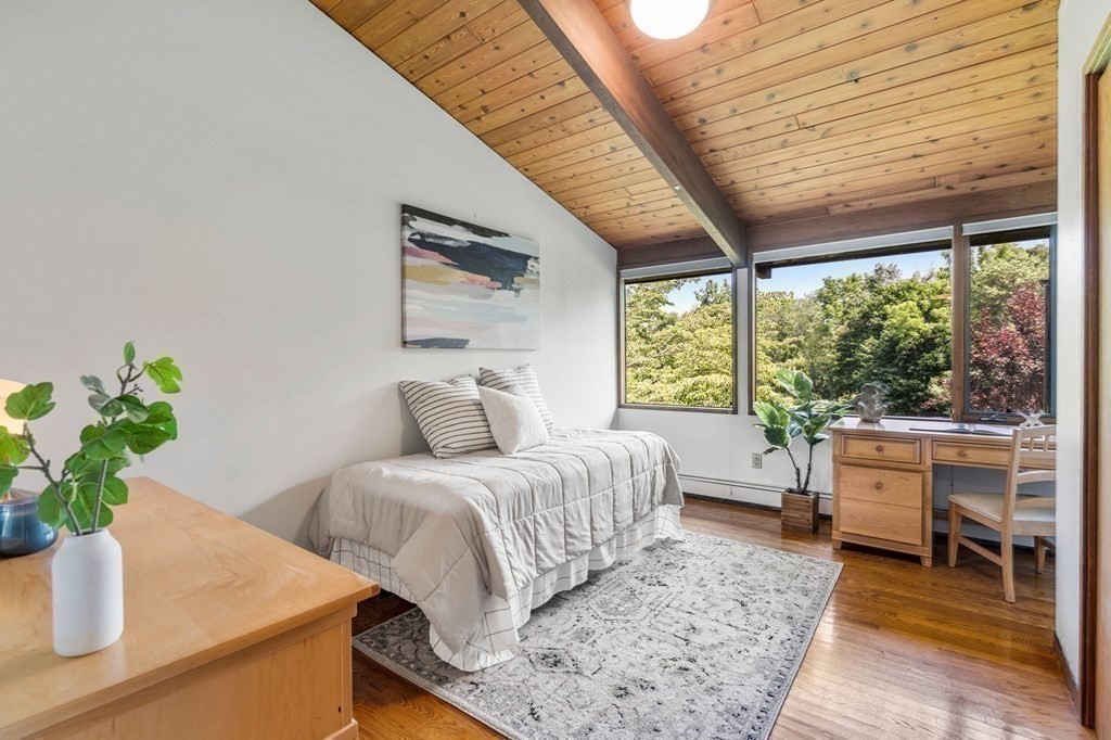 20 Meadowbrook Road Westwood, MA 02090 - Photo 20 of 36 a bedroom with a bed table flowerpot and window