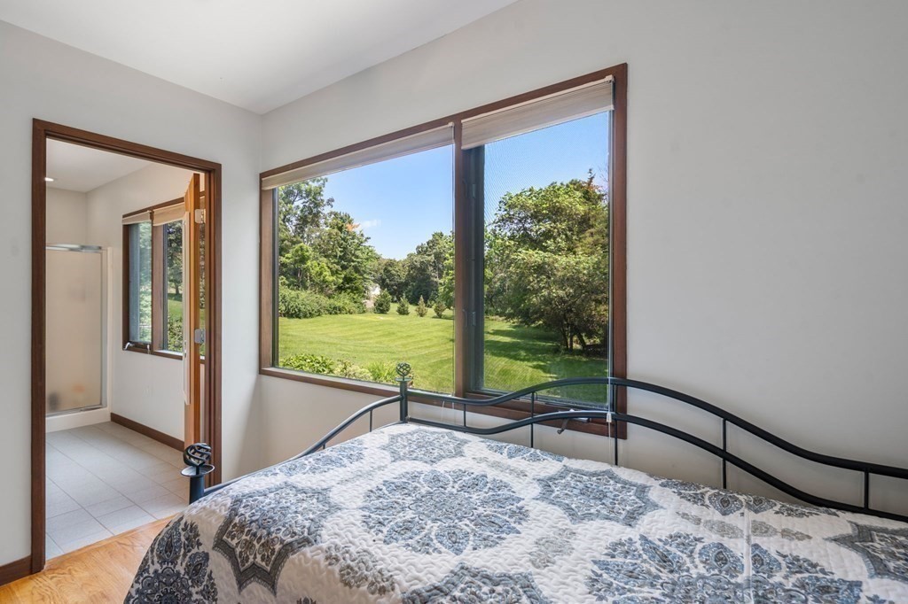 20 Meadowbrook Road Westwood, MA 02090 - Photo 22 of 36 a bed sitting in a bedroom next to a window