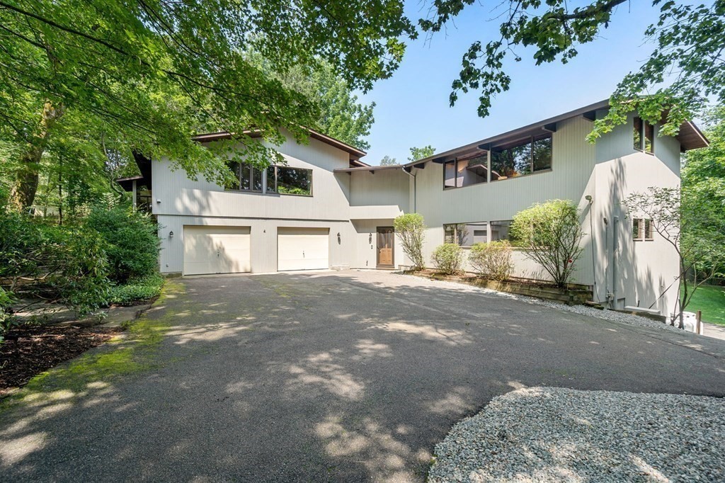 20 Meadowbrook Road Westwood, MA 02090 - Photo 3 of 36 a front view of a house with a yard and garage