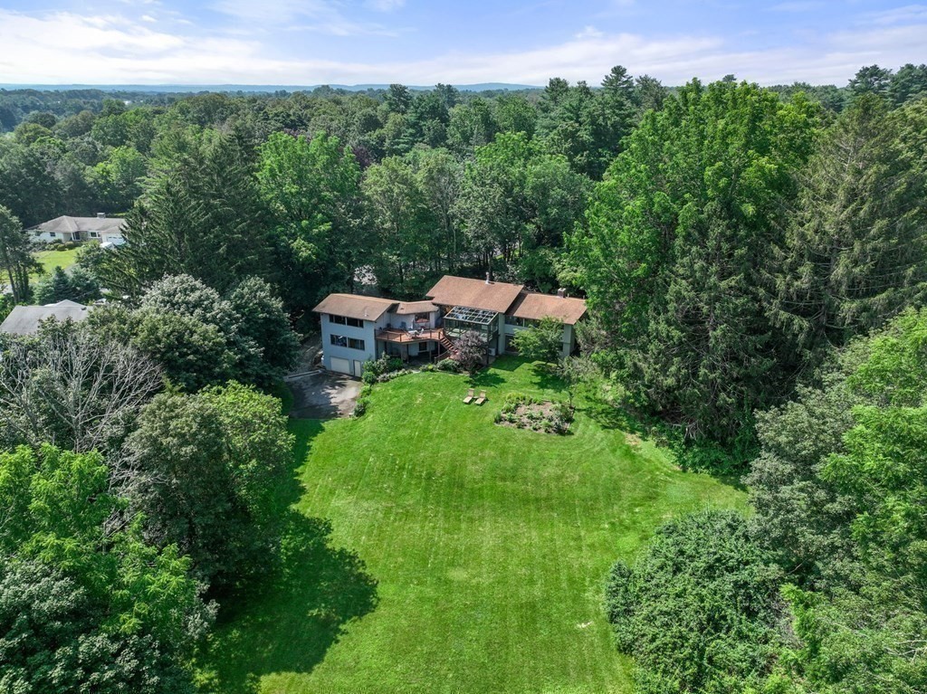 20 Meadowbrook Road Westwood, MA 02090 - Photo 36 of 36 a backyard of a house with a yard and outdoor seating