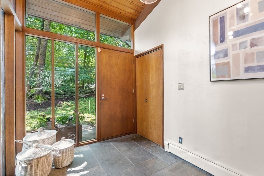 20 Meadowbrook Road Westwood, MA 02090 - Photo 5 of 36 a view of a room with a large window and floor to ceiling window