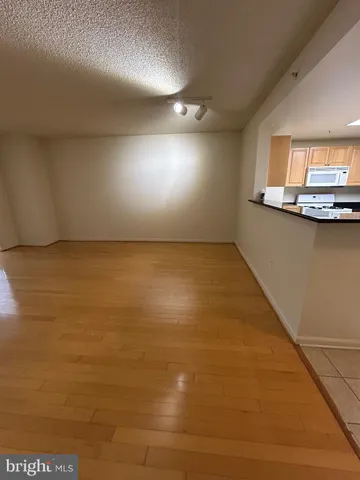 a view of room with kitchen