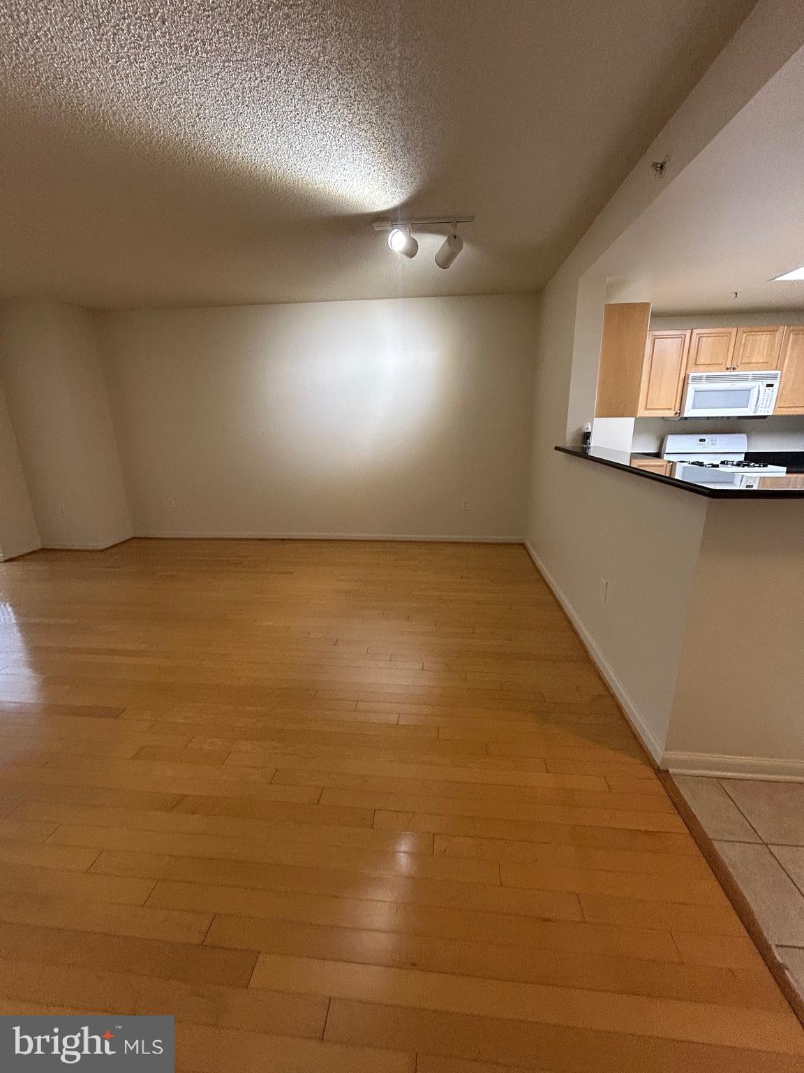 2726 Gallows Road, Unit 1104 Vienna, VA 22180 - Photo 13 of 37 a view of room with kitchen