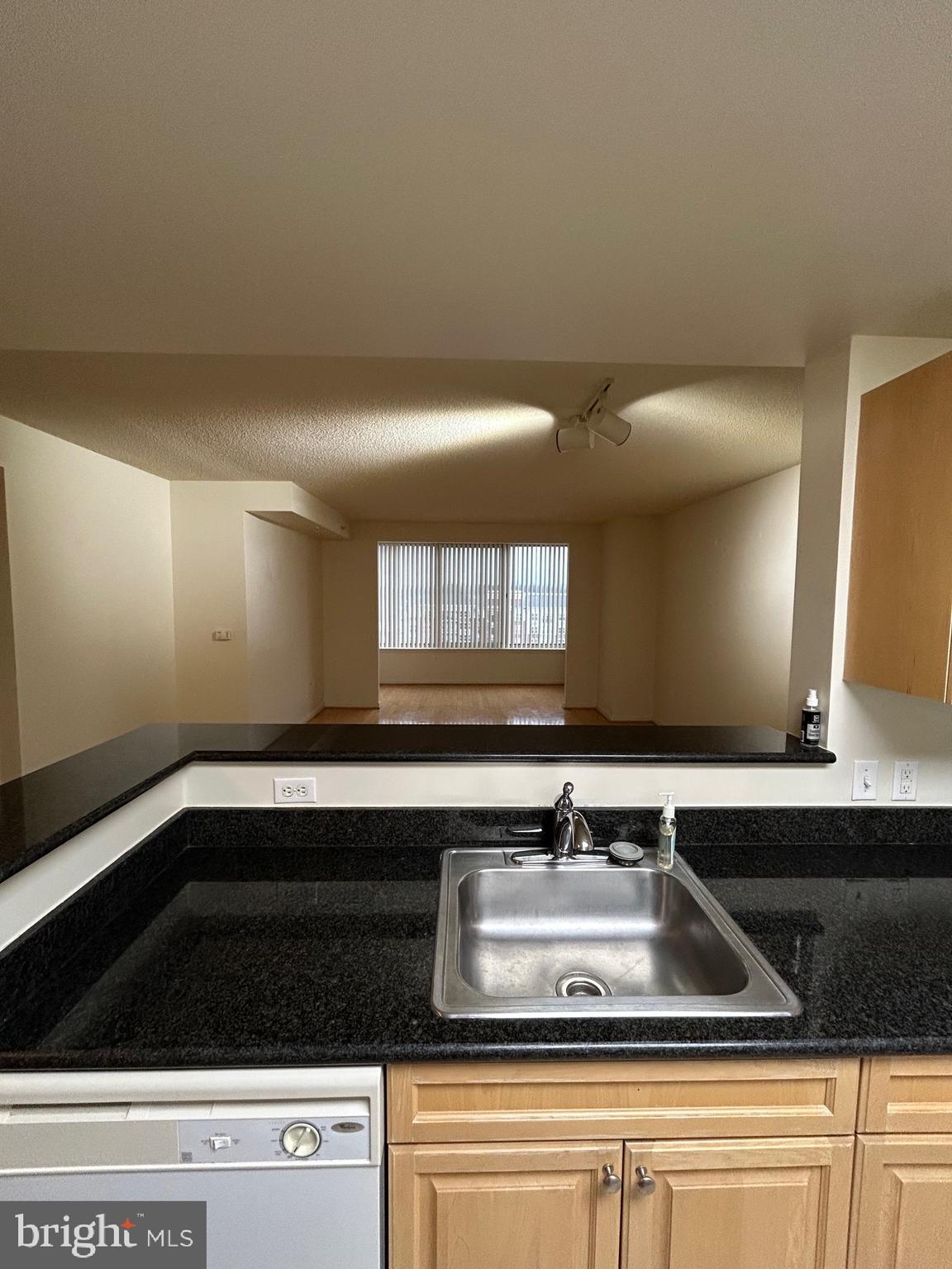 2726 Gallows Road, Unit 1104 Vienna, VA 22180 - Photo 15 of 37 a view of a sink a mirror and cabinets in a room
