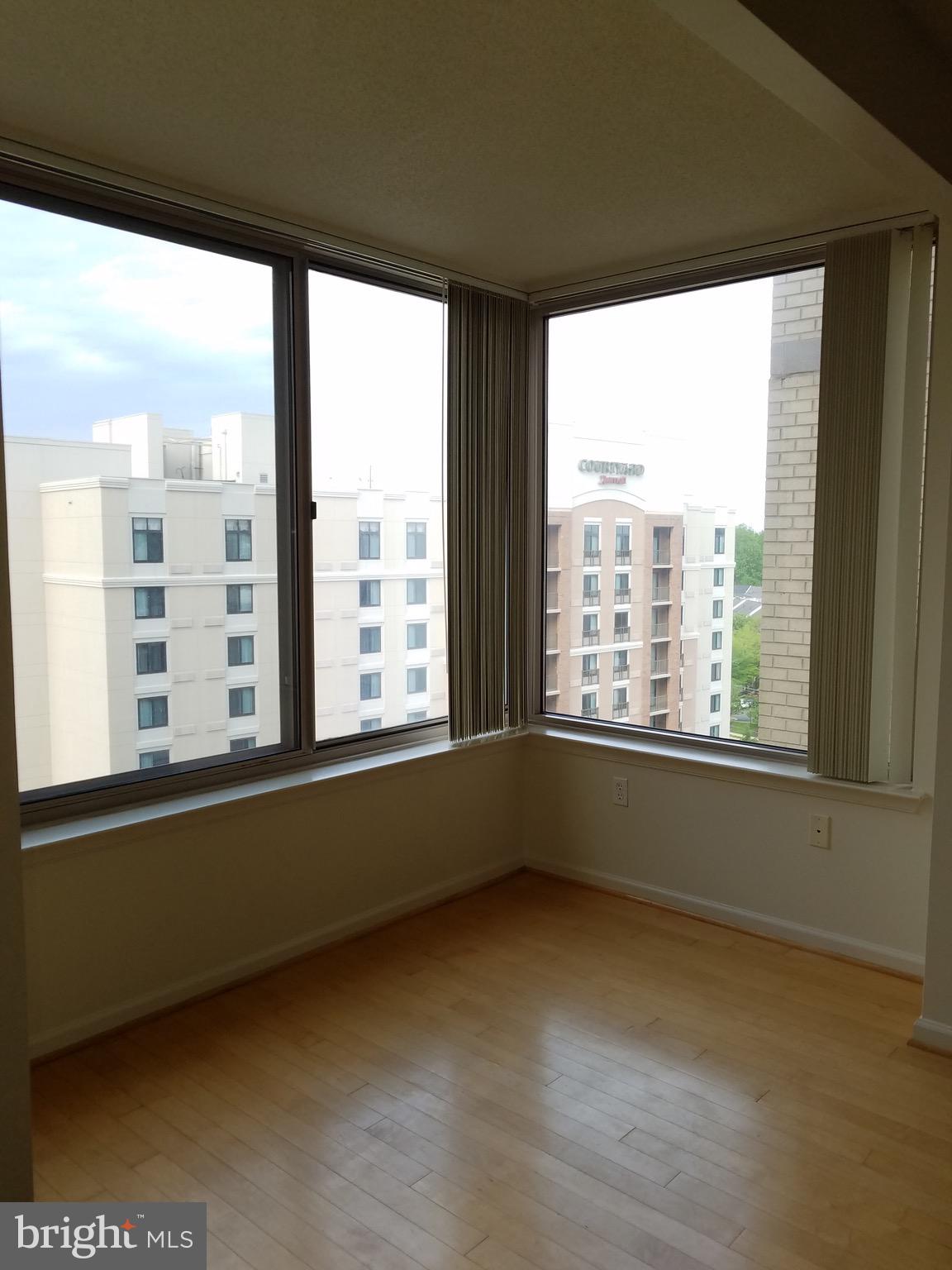 2726 Gallows Road, Unit 1104 Vienna, VA 22180 - Photo 19 of 37 a view of an empty room with a window