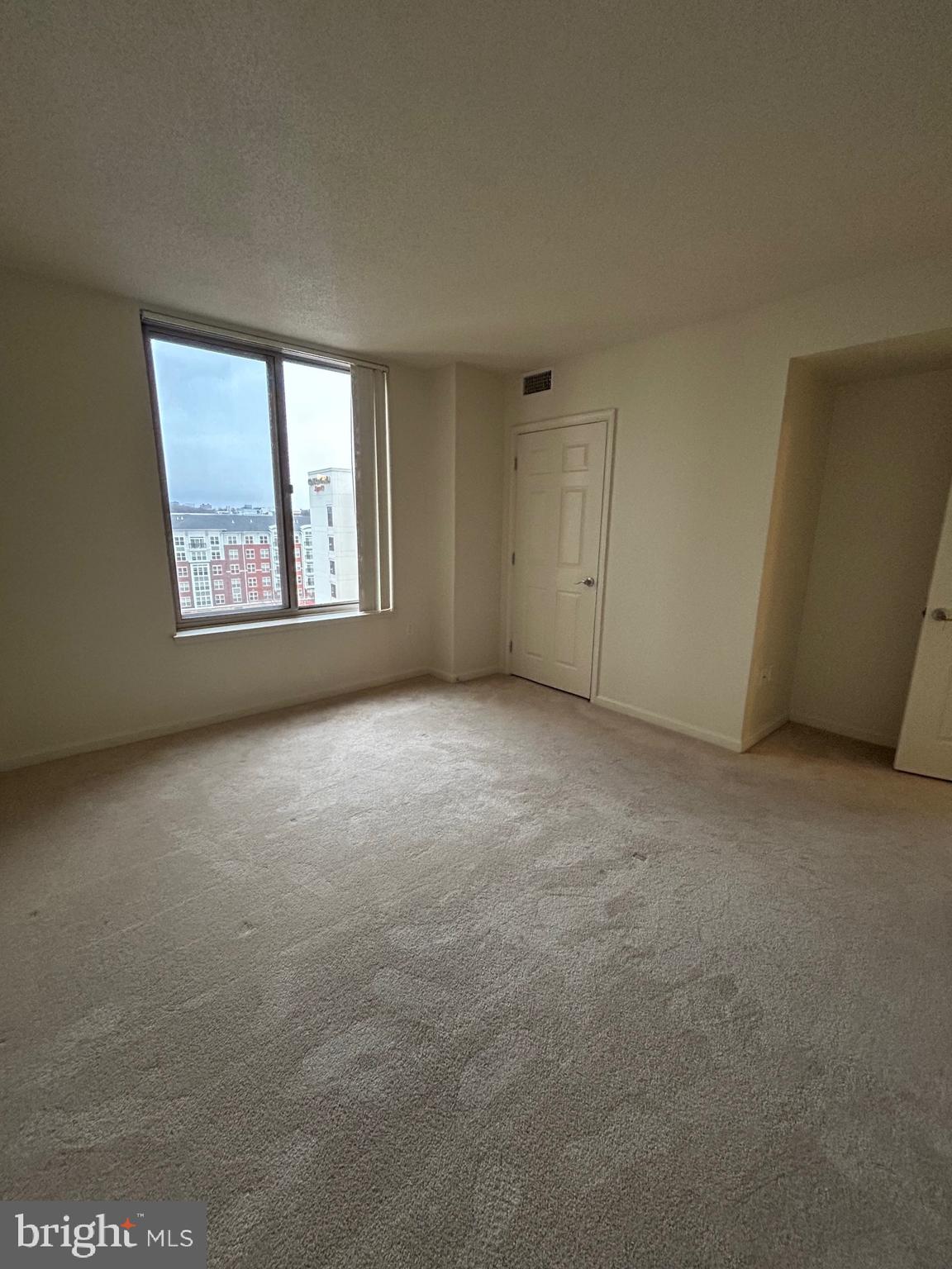 2726 Gallows Road, Unit 1104 Vienna, VA 22180 - Photo 22 of 37 a view of an empty room with a window