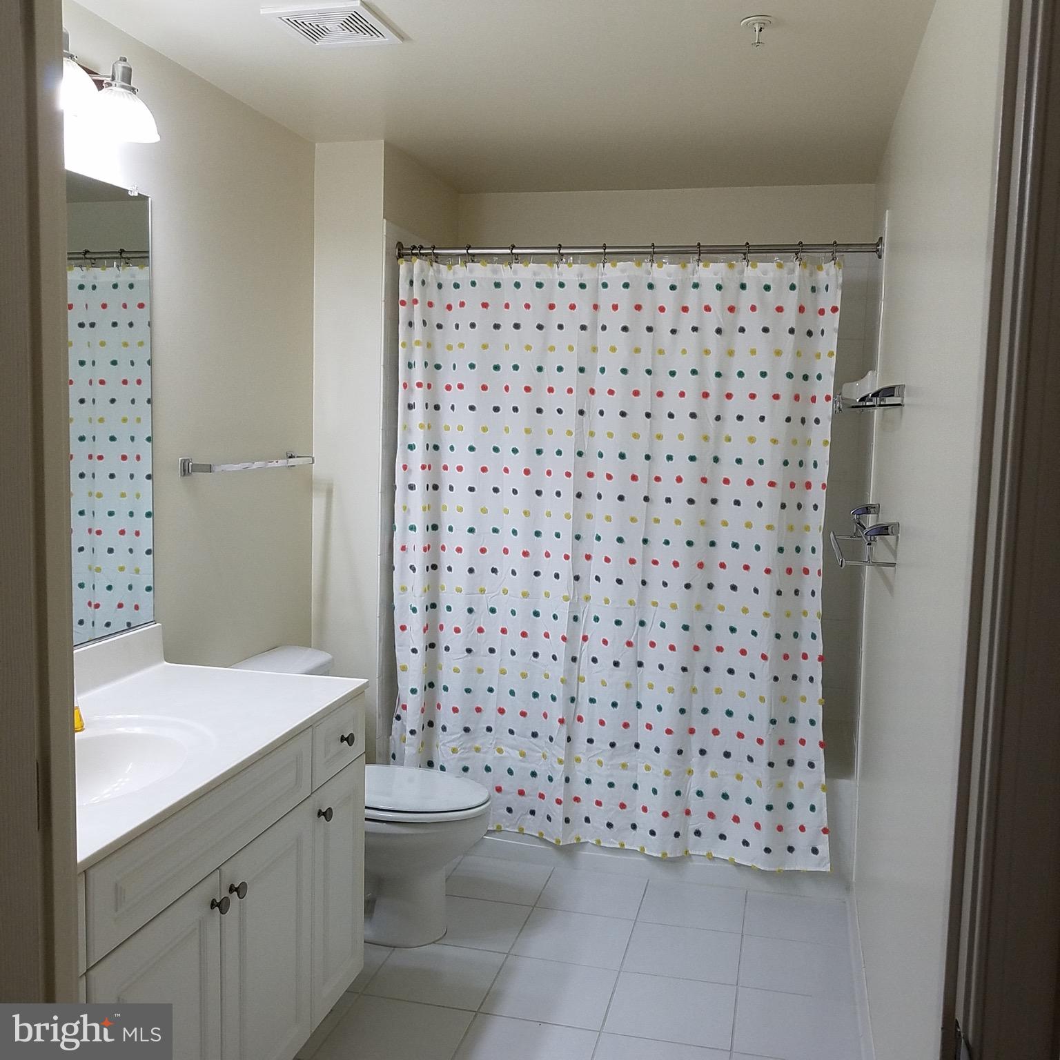 2726 Gallows Road, Unit 1104 Vienna, VA 22180 - Photo 24 of 37 a bathroom with a sink toilet and shower