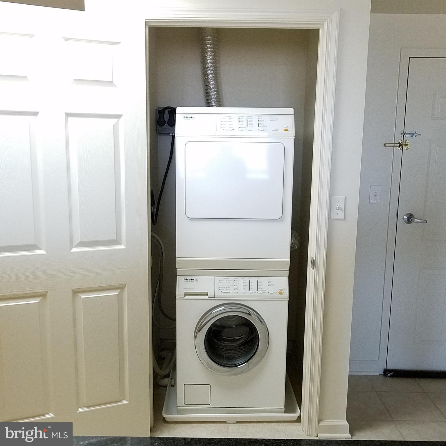 2726 Gallows Road, Unit 1104 Vienna, VA 22180 - Photo 27 of 37 a utility room with dryer and washer