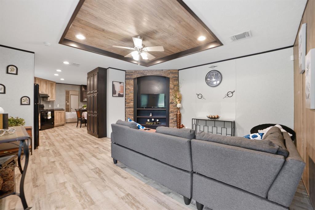 127 Almond Road Minden, LA 71055 - Photo 5 of 25 a living room with furniture and a chandelier