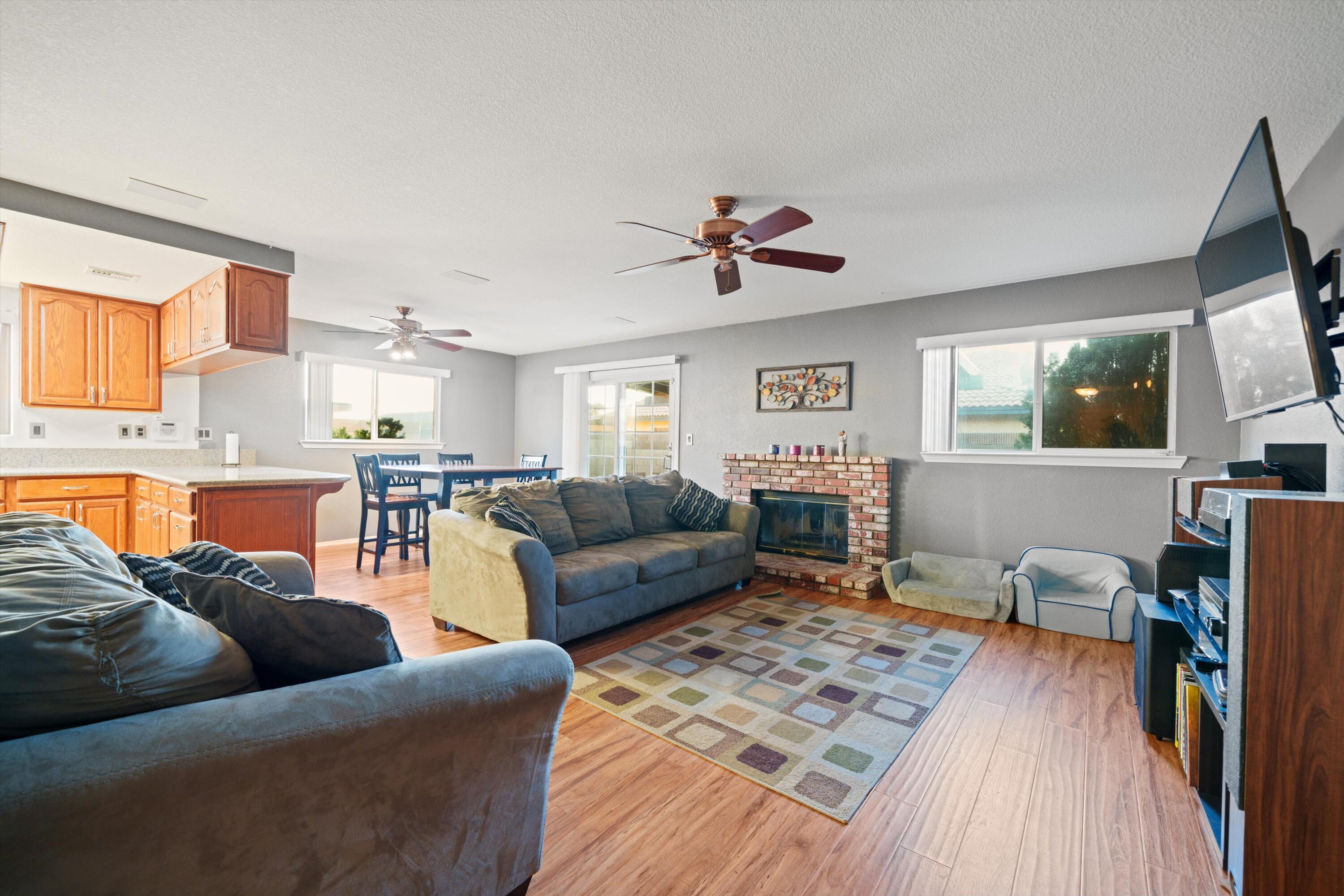 3525 West Roxbury Street Rosamond, CA 93560 - Photo 11 of 26 a living room with furniture and a flat screen tv