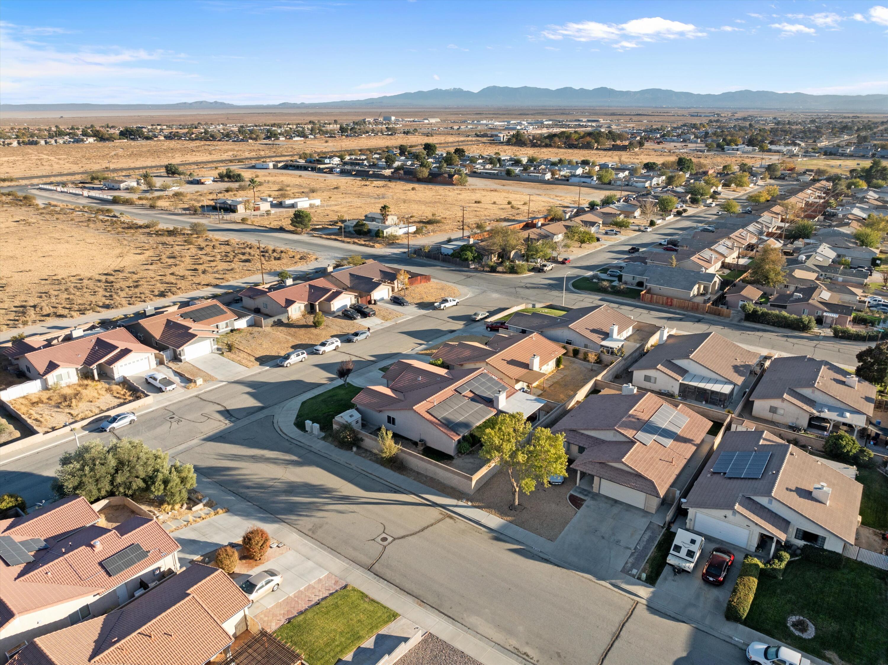 3525 West Roxbury Street Rosamond, CA 93560 - Photo 26 of 26 an aerial view of a city with lots of residential buildings