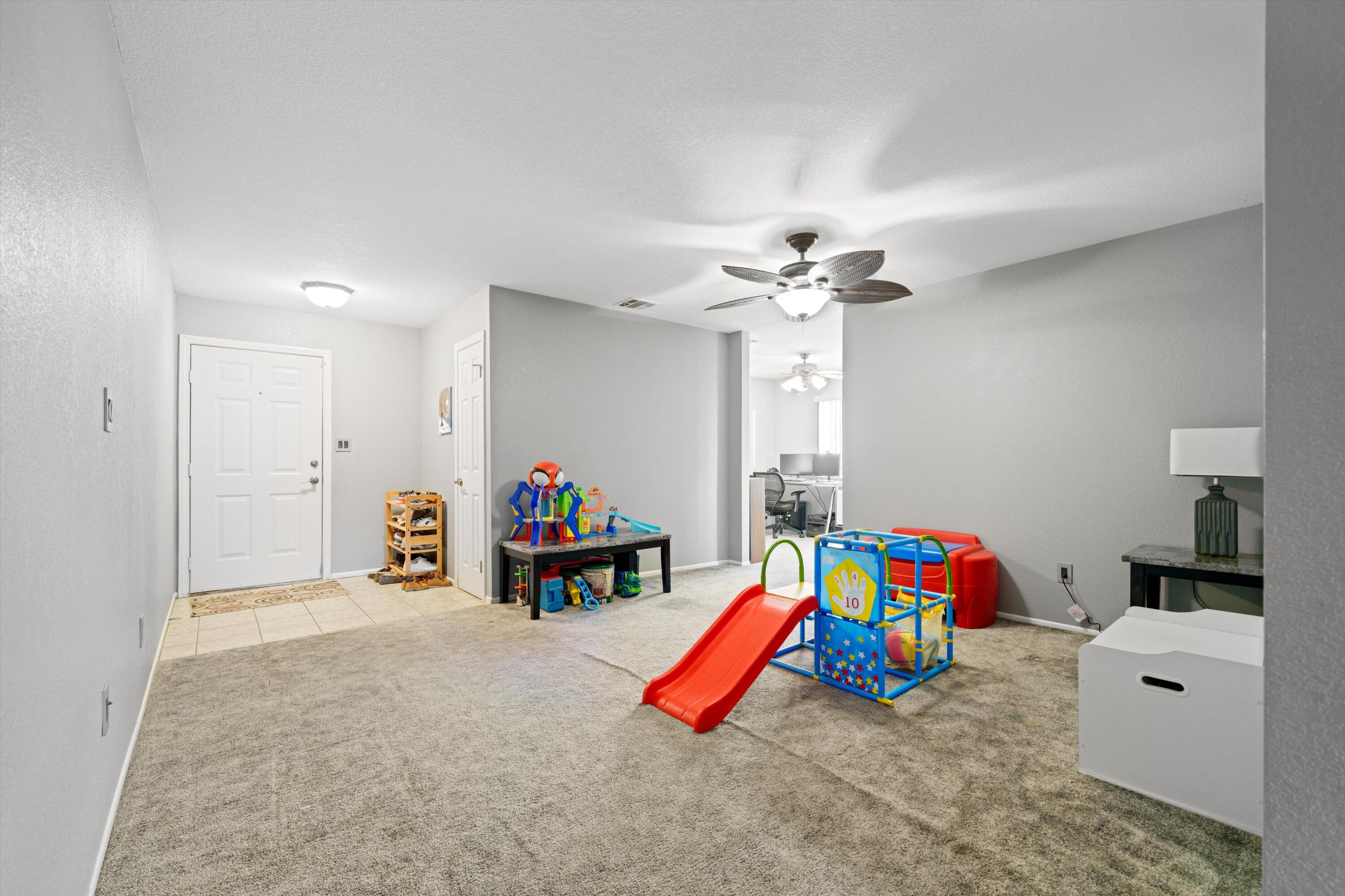 3525 West Roxbury Street Rosamond, CA 93560 - Photo 4 of 26 a view of a room with baby toys