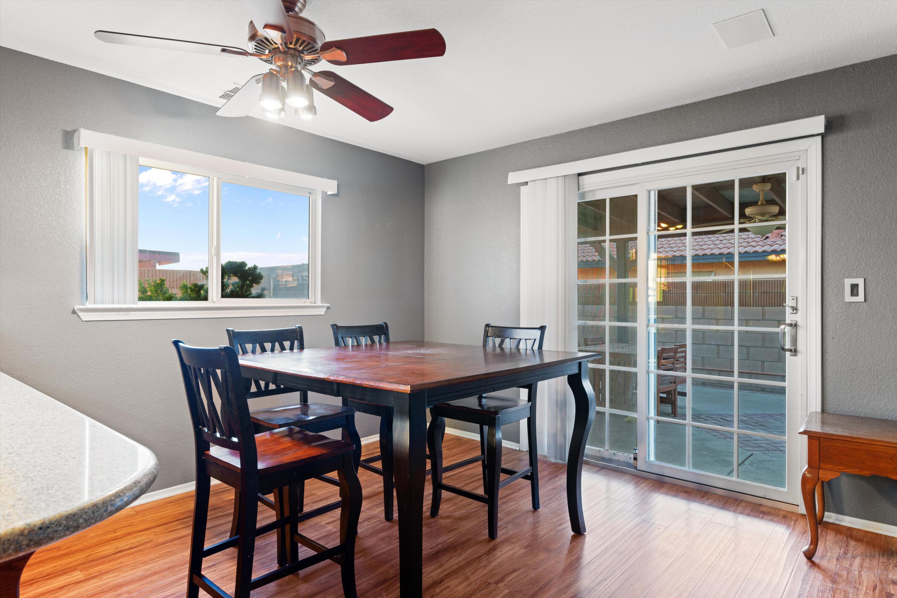 3525 West Roxbury Street Rosamond, CA 93560 - Photo 10 of 26 a view of a dining room with furniture window and wooden floor