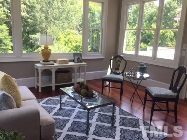 5216 Wynneford Way Raleigh, NC 27614 - Photo 11 of 28 The windows in the back of the home no longer have dividers...clear glass and a huge picture window allow you to fully absorb the beauty of the private backyard.