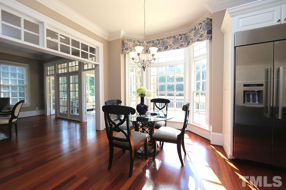 5216 Wynneford Way Raleigh, NC 27614 - Photo 12 of 28 The breakfast room now has a huge picture window with no grates with clear, operable windows on each side. Breakfast room is open to family room.