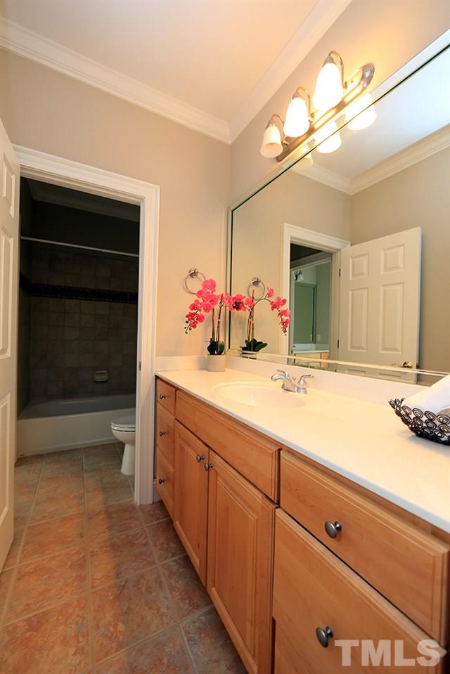 5216 Wynneford Way Raleigh, NC 27614 - Photo 19 of 28 Upstairs there are 3 full baths. This is the jack and jill bath with new cream marble counters, new faucets and lights.