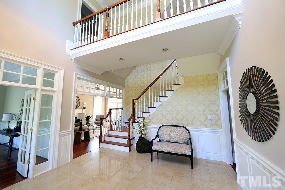 5216 Wynneford Way Raleigh, NC 27614 - Photo 4 of 28 A marble floor accents the grande foyer. To the right is the dining room and to the left is the office/study/formal living room with french doors.