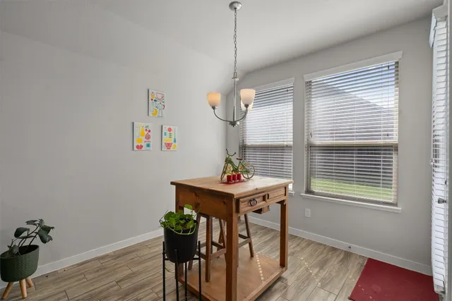 a view of a room with furniture window and wooden floor